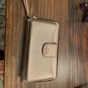 Rose gold shimmer Coach wristlet wallet. EUC